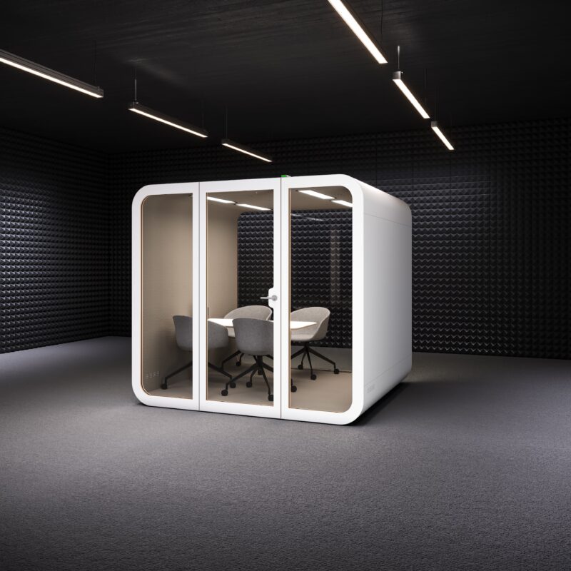 A modern white acoustic meeting pod by Urban 411, featuring glass doors, integrated lighting, and three gray ergonomic chairs inside a sound-absorbing studio environment.