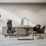 Contemporary private office with wood credenza, grey wall, and a high-back mesh Office Furniture Dubai chair.