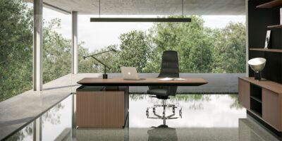 Dark executive desk with a high-back black leather chair, wood storage unit, and expansive window view for luxury office furniture dubai.